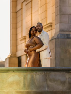 Engagement Session - I had the pleasure of capturing a beautiful engagement session for the Funderburks in the heart of Atlanta. From the moment they stepped in front of the camera, their love and connection were undeniable.

We started at the Millennium Gate exterior where the golden hour light created a warm and romantic glow. They shared candid laughs, intimate glances, and effortless chemistry that made for stunning, natural shots.

For their second look, we went for a more elegant feel at the park bridge overlooking the surrounding area with a classy yet artistic backdrop, where their formal attire added a sophisticated touch. Every shot was a perfect blend of love, personality, and style, reflecting their journey as a couple.

This session was a reminder of why I love engagement photography—capturing raw emotions and turning them into timeless