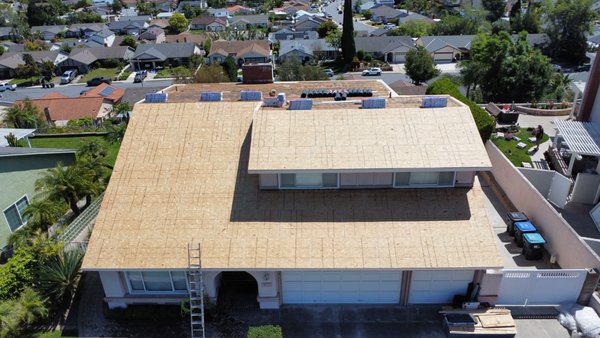 Roof Replacement - Full tear-off and roof replacement. The original roof had spaced sheathing, so we installed new OSB decking to create a solid, code-compliant base before shingling. Finished with GAF HDZ RS shingles on the main roof and a 2-layer torch-down system on the low-slope back section — quality materials matched to the right application for a long-lasting result.