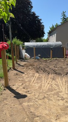 Levelling ground ￼ - Ripped out old grass, then proceeded to lay down, topsoil to flatten out ground ￼