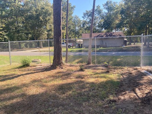 Residential 6' Chainlink fence - In this project the homeowner had just purchased this place and the first thing she wanted was to feel safe and secure without blocking the view of her beautiful, wooded neighborhood. By the end of the project, she was ecstatic with her new fence. It was an amazing project for amazing people.