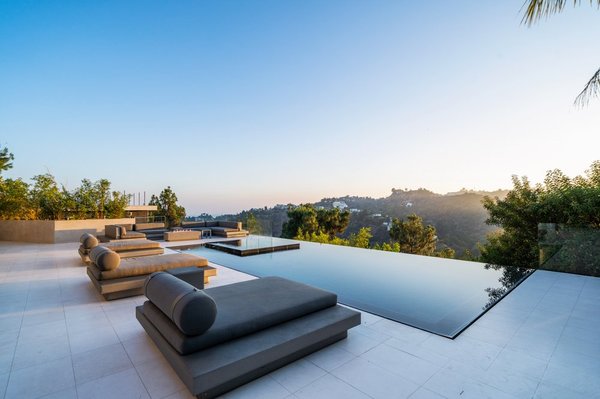 The Olympus Villa - Situated in the prominent Mount Olympus neighborhood, this sexy contemporary villa defines the ultimate entertainer's lifestyle with panoramic views perfectly framed throughout the home. The main floor features an open floor plan with a spacious living room, formal dining area, chef's kitchen, and vanishing glass walls that open to a decadent outdoor space. Outside you’ll find a zero-edge infinity pool, spa, and multiple seating areas perfect for California sunsets. The luxurious primary suite upstairs features soaring ceilings, a large soaking tub, and dual walk-in closets. The basement level delivers a large screening room with reclining seating for 12, game room, sauna, and guest shower. Offering privacy and unmatched views just moments from the Sunset Strip, this stunning entertainer's dream is a must-see! The Olympus Villa - Situated in the prominent Mount Olympus neighborhood, this sexy contemporary villa defines the ultimate entertainer's lifestyle with panoramic views perfectly framed throughout the home. The main floor features an open floor plan with a spacious living room, formal dining area, chef's kitchen, and vanishing glass walls that open to a decadent outdoor space. Outside you’ll find a zero-edge infinity pool, spa, and multiple seating areas perfect for California sunsets. The luxurious primary suite upstairs features soaring ceilings, a large soaking tub, and dual walk-in closets. The basement level delivers a large screening room with reclining seating for 12, game room, sauna, and guest shower. Offering privacy and unmatched views just moments from the Sunset Strip, this stunning entertainer's dream is a must-see!