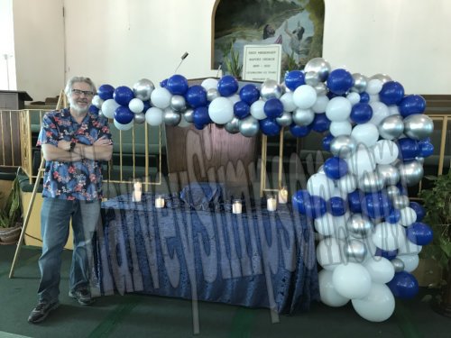 Organic BalloonArch - Balloon Decor is a perfect alternative to flowers...Here is an organic balloon arch/garland that had specific dimensions for the Celebration of Life event. The horizontal piece had to be situated between the urn and the pulpit. We did it! What made this very challenging was that fact that there was no vertical attachment point. So that balloons had to built onto a frame that would support the weight of the balloons and the horizontal bar. The engineer in me loved finding this solution. Also NO helium, EVERYTHING we create is air inflated. Organic BalloonArch - Balloon Decor is a perfect alternative to flowers...Here is an organic balloon arch/garland that had specific dimensions for the Celebration of Life event. The horizontal piece had to be situated between the urn and the pulpit. We did it! What made this very challenging was that fact that there was no vertical attachment point. So that balloons had to built onto a frame that would support the weight of the balloons and the horizontal bar. The engineer in me loved finding this solution. Also NO helium, EVERYTHING we create is air inflated.