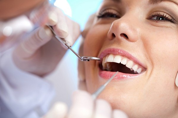 DENTAL FILLINGS - Cavities and tooth decay are among the worlds most common health problems.  They are especially common in children, teenagers, and older adults.  However, anyone with teeth, including infants, can get cavities. 

When a tooth has a cavity, the typical solution is a dental filling.  Cavities, or caries, are permanently damaged areas in the hard surface of your teeth that develop into tiny openings, or holes.  Fillings are a very effective solution, especially when cavities are found before they have a chance to grow very big. 

HOW DO DENTAL FILLINGS WORK?
Dental fillings are an extremely common procedure that Dr. Brazdo has perfected over the years. We use only tooth-colored fillings to correct decay for its superior quality and predictability. Upon detecting decay, your dentist will only need to remove the decayed portion of the tooth. Unlike silver amalgam fillings of the past, composite bonded, tooth-colored fillings do not require the removal of healthy tooth tissue. Dr. Brazdo will fill the cavity and shine a specialized light to bond the filling to the tooth. This type of filling is reliable, predictable, and most importantly a non-invasive procedure that can be performed in one visit. This high-quality, bonded material not only flawlessly blends into the natural tooth, but it is also resistant to cracking, loosening, and fracture. Further, it will cause no harm to your natural tooth.

WHAT IS THE PROCESS FOR FILLING A TOOTH?

First, your tooth and surrounding gum tissue will be numbed using a local anesthetic.  The drug temporarily cuts off communication between your tooth and brain so you will feel no pain.  When your mouth is numb, the decayed portion of your tooth will be removed using a high-speed handpiece. 

After the damaged portion is removed, a blue gel will be applied to the prepared tooth.  This gel roughens the surface of the tooth microscopically to ensure the composite resin bonds strongly with your tooth.

The blue gel is rinsed away and the tooth is dried.  Cotton rolls are placed around the tooth to ensure it stays dry during the procedure.

A small amount of priming and a bonding agent is brushed onto the prepared tooth. This step kills bacteria and ensures a strong bond between your tooth and the filling.

The composite resin is placed inside your prepared tooth.  It is dispensed in a dough-like consistency so it can be formed and shaped.

The composite will be smoothed and air bubbles removed using an instrument.  

A blue light is applied to the filling. The light cures and hardens the filling. Depending on the size and location of your cavity, the light may be used more than once.

The filling will be shaped to resemble your natural tooth structure.

A bite test using carbon paper is conducted to ensure your teeth fit together comfortably. If necessary, Dr. Brazdo will file down and smooth the filling so your teeth fit together properly.