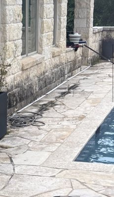 Lakeway Limestone Pool Patio & Stone Restoration - This poolside limestone patio and stone wall had developed heavy organic staining and discoloration from moisture exposure, creating dark buildup along the lower portions of the masonry. Using a specialized low-pressure soft wash process, we treated and removed the organic growth while protecting the delicate limestone surfaces from damage.
The result was a dramatically cleaner appearance with restored stone color, improved curb appeal, and a refreshed outdoor living space. Special care was taken to clean the limestone safely around the pool area and surrounding landscaping.
Services performed:
• Limestone patio cleaning
• Organic stain removal
• Low-pressure soft washing
• Pool deck cleaning
• Exterior stone restoration
Location: Lakeway, TX Lakeway Limestone Pool Patio & Stone Restoration - This poolside limestone patio and stone wall had developed heavy organic staining and discoloration from moisture exposure, creating dark buildup along the lower portions of the masonry. Using a specialized low-pressure soft wash process, we treated and removed the organic growth while protecting the delicate limestone surfaces from damage.
The result was a dramatically cleaner appearance with restored stone color, improved curb appeal, and a refreshed outdoor living space. Special care was taken to clean the limestone safely around the pool area and surrounding landscaping.
Services performed:
• Limestone patio cleaning
• Organic stain removal
• Low-pressure soft washing
• Pool deck cleaning
• Exterior stone restoration
Location: Lakeway, TX