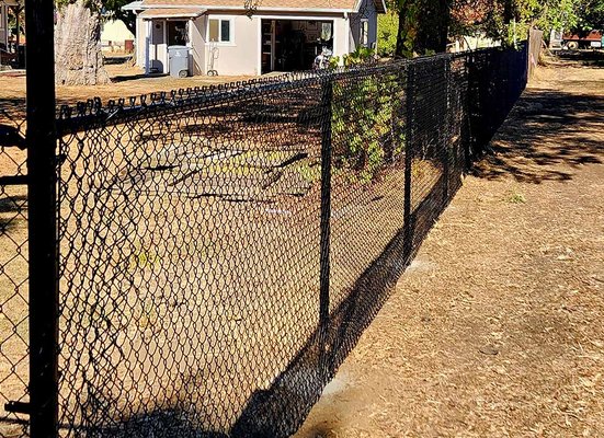 Chain Link Fences - Chain link fences are also a fantastic option for enclosing large residential properties or smaller enclosures like dog runs, pools and closing off utility areas.
