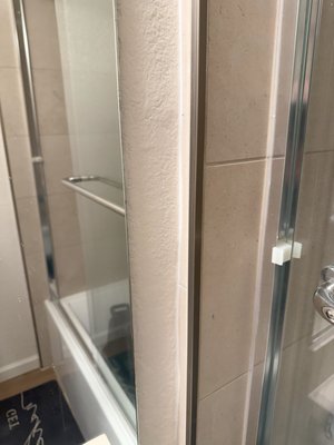 Bathroom Drywall Repair - This drywall was in desperate need of repair after exterior construction caused the joint to crumble and pieces to fall. We were able to quickly rectify the situation and provide a finished product that was indistinguishable from the original