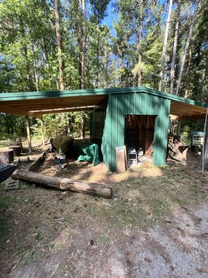 Acorn lodge equipment barn - Built a new storage shed with awnings on both sides for this lodge equipment