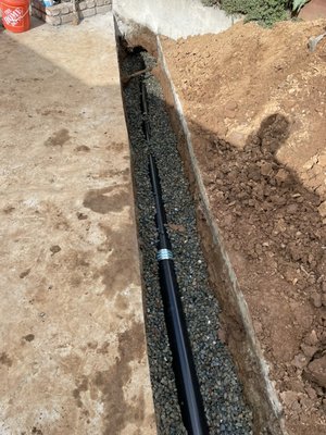 Sewer lateral replacement - This project was for a house on the hill that was slowly sliding. Foundation reinforcement company stopped the sliding but it was too late for the slope of the sewer. Now we needed to run a new sewer open trench from the house to further down the main to catch a better slope. Tied into the main with new clay wye. Broken Pipes, Blockage, Corrosion, Sewer Replacements, Sewer Cleaning, and Sewer System Repair