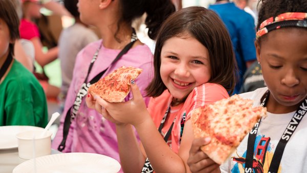 Snacks & Lunch Included - Get ready for a summer without packing lunches. Our camp includes an array of tasty grub throughout the day. In partnership with fan favorite restaurants, we keep kids fired up with food they love — from pizza to sandwiches to salads. We also provide rotating sides at lunch, as well as snacks for kids whenever their fuel gauge dips into the red. Best part? It's included. No hectic mornings packing a lunch. Snacks & Lunch Included - Get ready for a summer without packing lunches. Our camp includes an array of tasty grub throughout the day. In partnership with fan favorite restaurants, we keep kids fired up with food they love — from pizza to sandwiches to salads. We also provide rotating sides at lunch, as well as snacks for kids whenever their fuel gauge dips into the red. Best part? It's included. No hectic mornings packing a lunch.