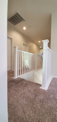White Paint Staircase Project - This project prior to my arrival to start it, had been applied by someone a paint stripper gel. I stripped all the railing to the wood and sand it smooth for a better sooth finish. This staircase was spray painted white color.
