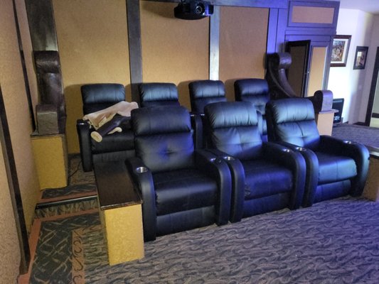Theatre Remodel - Remodel of existing home theatre including new walnut pilasters, new walnut coffered ceiling, new indirect LED lighting and re-wrapping existing fabric covered sound panels.