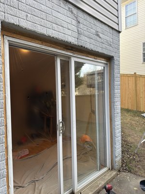 Sliding door installation - Remove existing door, replace rotten wood, install new door, lock installation included, replace exterior trim, apply new sealant and new paint.