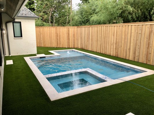 Highland Park Installation Around Pool & Putting Surface - This is a backyard project in Highland Park Texas. We put antimicrobial soft American Made Turf around the pool with a putting surface in the back by the AC units. All of our turf is American Made with a 15 Year Product Warranty. Highland Park Installation Around Pool & Putting Surface - This is a backyard project in Highland Park Texas. We put antimicrobial soft American Made Turf around the pool with a putting surface in the back by the AC units. All of our turf is American Made with a 15 Year Product Warranty.