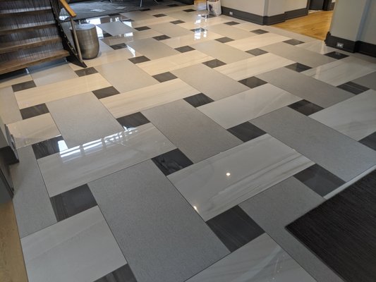 Lobby floor replacement - The owners of this commercial building were forced to replace the tiles on the lobby floor due to wear and tear. They decided to go with a more modern version, while maintaining the current atmosphere. Lobby floor replacement - The owners of this commercial building were forced to replace the tiles on the lobby floor due to wear and tear. They decided to go with a more modern version, while maintaining the current atmosphere.