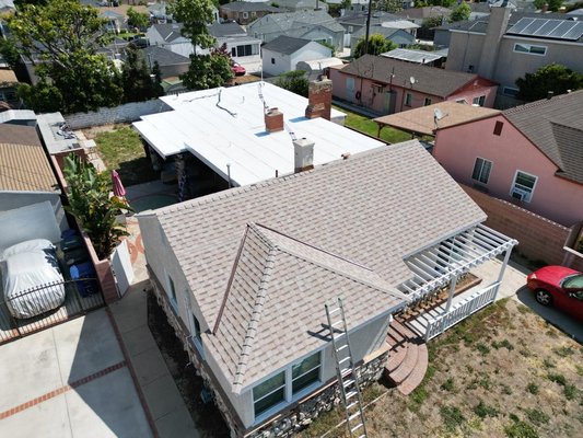 Roof transformation completed, Roof replacement in North Hollywood, CA - At Alpha One Construction, we recently undertook an exciting project involving a full roof replacement. The task involved tearing down the existing shingle roof and flat roof and replacing them both, creating a harmonious and durable roofing solution. In this post, we'll take you through the details of the project and discuss the various options we considered to ensure a successful roof transformation.

Project Details:
Our team embarked on this project with a mission to provide our client with a long-lasting and aesthetically pleasing roofing solution. The house had a combination of shingle and flat roofs, which presented us with a unique challenge. To achieve a cohesive and uniform appearance, we decided to replace both sections of the roof simultaneously.

Replacing the Shingle Roof:
The first step involved removing the old shingles carefully, ensuring minimal damage to the underlying structure. We then inspected the roof deck for any signs of deterioration or weakness and made necessary repairs. Our client had the freedom to choose from a range of high-quality shingle options, allowing them to select the perfect style and color to enhance their home's curb appeal.

Revamping the Flat Roof:
Next, we turned our attention to the flat roof section of the house. Flat roofs require specific expertise, and our skilled team was well-prepared to tackle the challenge. We utilized advanced roofing materials designed explicitly for flat roofs, providing superior durability and weather resistance. Additionally, we incorporated proper insulation and effective drainage systems to prevent common issues such as leaks and ponding.

Sealing the Deal:
Once both the shingle and flat roofs were in place, we conducted a thorough inspection to ensure every detail was taken care of. Our commitment to quality ensured that the new roof was not only visually appealing but also structurally sound, providing our client with peace of mind for years to come.

Conclusion:
The completion of this full roof replacement project marked another successful endeavor for Alpha One Construction. Our team's dedication, expertise, and attention to detail were crucial in transforming a mixed roof into a seamless whole. If you're considering a roof replacement, don't hesitate to reach out to us at Alpha One Construction.