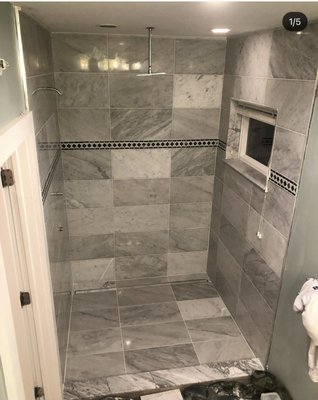 Shower Remodel - Shower Remodel - wet bed - natural stone white Carrara - custom black and white diamond marble chase - linear drain - plumbing - Hollywood Bebble windowsill Shower Remodel - Shower Remodel - wet bed - natural stone white Carrara - custom black and white diamond marble chase - linear drain - plumbing - Hollywood Bebble windowsill