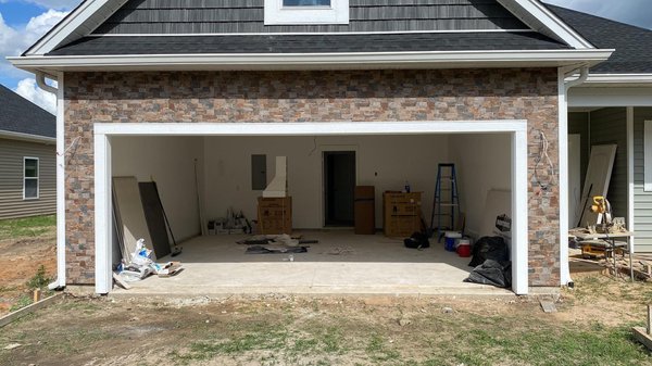 Garage Remodeling For A Modern Look - Transform your garage into a functional and stylish space with our garage remodel services! Whether you're looking to create a home gym, workshop, or extra living space, our team of experienced professionals has the skills and expertise to bring your vision to life. From custom flooring and storage solutions to electrical and HVAC upgrades, we'll work with you every step of the way to ensure your garage remodel meets your exact needs and budget. Plus, with our commitment to using high-quality materials and delivering exceptional customer service, you can trust that your project is in good hands. Don't settle for a cluttered and underutilized garage - contact us today to schedule a consultation and start planning your dream space! Garage Remodeling For A Modern Look - Transform your garage into a functional and stylish space with our garage remodel services! Whether you're looking to create a home gym, workshop, or extra living space, our team of experienced professionals has the skills and expertise to bring your vision to life. From custom flooring and storage solutions to electrical and HVAC upgrades, we'll work with you every step of the way to ensure your garage remodel meets your exact needs and budget. Plus, with our commitment to using high-quality materials and delivering exceptional customer service, you can trust that your project is in good hands. Don't settle for a cluttered and underutilized garage - contact us today to schedule a consultation and start planning your dream space!