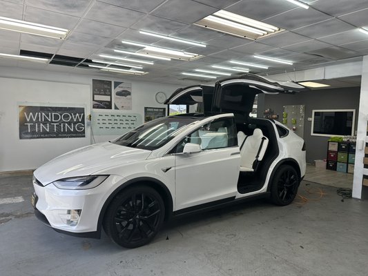 Tesla Model X Full Ceramic Tint - Model X windshield in one piece!
First the film is shrunk then cut on outside. Inside is deep cleaned and the tint is applied. Good for heat rejection and UV rejection! Tesla Model X Full Ceramic Tint - Model X windshield in one piece!
First the film is shrunk then cut on outside. Inside is deep cleaned and the tint is applied. Good for heat rejection and UV rejection!