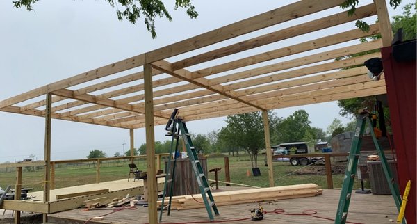 Outdoor bar stage and roof covering - Bar owner said she needed a stage put up in time for an event she was hosting (about a week) and wanted to extend the roof out all the way over the deck and stage. got it done just in time and even got to stay for the event, on the house, of course! Outdoor bar stage and roof covering - Bar owner said she needed a stage put up in time for an event she was hosting (about a week) and wanted to extend the roof out all the way over the deck and stage. got it done just in time and even got to stay for the event, on the house, of course!