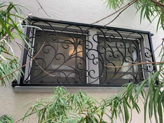 Decorative Security Window Guards – Los Feliz - We custom-fabricated and installed wrought iron window grilles featuring flowing scrollwork designs. These grilles provide added safety while enhancing the home’s exterior with an elegant, handcrafted detail.