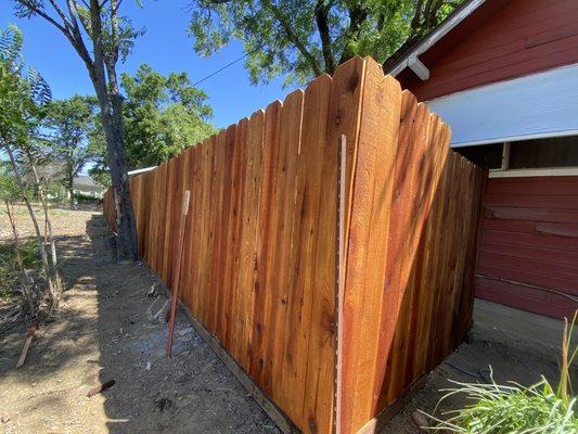 Fencing Project - This client had her fencing falling due to the post rotting and we came in to fix that. Put in two new gates, installed about 130' of fencing and stained this lovely dog ear redwood fencing.