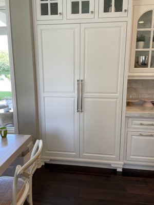 White Victorian Pantry with Walnut Interior. Orange CA - Custom Pantry Section of a Victorian Style Cabinet. White Face Frame Cabinetry, with Inset Raised Panel Doors; and Integrated Decorative Feet, and French Light Glass Doors Above. Interior Consists of Walnut Drawers and Door Racks, with Laser Etched Drawer Fronts. Orange CA White Victorian Pantry with Walnut Interior. Orange CA - Custom Pantry Section of a Victorian Style Cabinet. White Face Frame Cabinetry, with Inset Raised Panel Doors; and Integrated Decorative Feet, and French Light Glass Doors Above. Interior Consists of Walnut Drawers and Door Racks, with Laser Etched Drawer Fronts. Orange CA