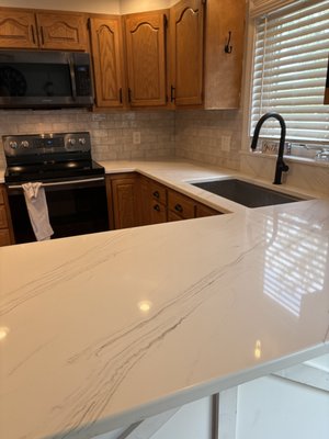 Beautiful Kitchen Remodel in Belchertown - ✨ Another beautiful kitchen transformation completed by D&C Granite & Marble!
These stunning quartz countertops completely refreshed this space with a clean, bright, and timeless look. The soft veining pairs perfectly with the warm wood cabinetry, while the full-height backsplash and modern black fixtures bring everything together beautifully.
From fabrication to installation, our team focuses on craftsmanship, precision, and attention to detail every step of the way.
Thinking about updating your kitchen? Let D&C Granite & Marble help bring your vision to life with custom granite, quartz, and marble countertops built to last.
📍 Proudly serving Western Massachusetts
📞 Contact us today for a free estimate! Beautiful Kitchen Remodel in Belchertown - ✨ Another beautiful kitchen transformation completed by D&C Granite & Marble!
These stunning quartz countertops completely refreshed this space with a clean, bright, and timeless look. The soft veining pairs perfectly with the warm wood cabinetry, while the full-height backsplash and modern black fixtures bring everything together beautifully.
From fabrication to installation, our team focuses on craftsmanship, precision, and attention to detail every step of the way.
Thinking about updating your kitchen? Let D&C Granite & Marble help bring your vision to life with custom granite, quartz, and marble countertops built to last.
📍 Proudly serving Western Massachusetts
📞 Contact us today for a free estimate!