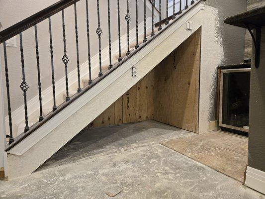 'Nook' space under stairs. - Client had water damage from a Basement Flood and wanted to convert the space into a nook area so she can later have shelves and cabinets In 'Nook' space under stairs. - Client had water damage from a Basement Flood and wanted to convert the space into a nook area so she can later have shelves and cabinets In