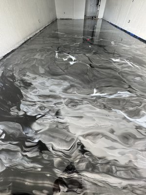 Metallic Epoxy Floor installation in Commercial Space Kendall FLorida - r in black, silver, and pearl. The result? A sleek, high-gloss finish that combines durability with luxury, perfectly complementing the shop's modern aesthetic.
This floor is not only visually striking but also built to withstand daily foot traffic and wear, making it the ideal choice for commercial spaces.
Thinking of upgrading your floors with a unique, durable design? Contact Suncrete Coatings today to bring your vision to life in Miami-Dade and Broward! Metallic Epoxy Floor installation in Commercial Space Kendall FLorida - r in black, silver, and pearl. The result? A sleek, high-gloss finish that combines durability with luxury, perfectly complementing the shop's modern aesthetic.
This floor is not only visually striking but also built to withstand daily foot traffic and wear, making it the ideal choice for commercial spaces.
Thinking of upgrading your floors with a unique, durable design? Contact Suncrete Coatings today to bring your vision to life in Miami-Dade and Broward!