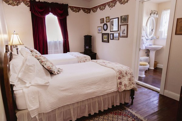 Brown Bear - Room 5 - Experience the perfect base for all your Trinity Alps adventures in the Brown Bear room, featuring two twin beds. Whether you're here to fish, hike, or simply spend time with family/friends, the Brown Bear room at the Weaverville Hotel offers a well-equipped, comfortable retreat. Elegantly designed in period-specific details, the imagery of Brown Bear room reflects the area's rich fishing history.
Brown Bear is part of the Weaverville Hotel at the base of the stunning Trinity Alps. Enjoy easy access to hikes, fishing, lakes, mountains and more, making it the perfect base for all your North State adventures.
This room features:
- Two twin beds
- A Victorian stove
- Coffee station
- High speed internet
- Soaking tub
- Access to a shared parlor space (open from 7 a.m. — 10 p.m.) Brown Bear - Room 5 - Experience the perfect base for all your Trinity Alps adventures in the Brown Bear room, featuring two twin beds. Whether you're here to fish, hike, or simply spend time with family/friends, the Brown Bear room at the Weaverville Hotel offers a well-equipped, comfortable retreat. Elegantly designed in period-specific details, the imagery of Brown Bear room reflects the area's rich fishing history.
Brown Bear is part of the Weaverville Hotel at the base of the stunning Trinity Alps. Enjoy easy access to hikes, fishing, lakes, mountains and more, making it the perfect base for all your North State adventures.
This room features:
- Two twin beds
- A Victorian stove
- Coffee station
- High speed internet
- Soaking tub
- Access to a shared parlor space (open from 7 a.m. — 10 p.m.)
