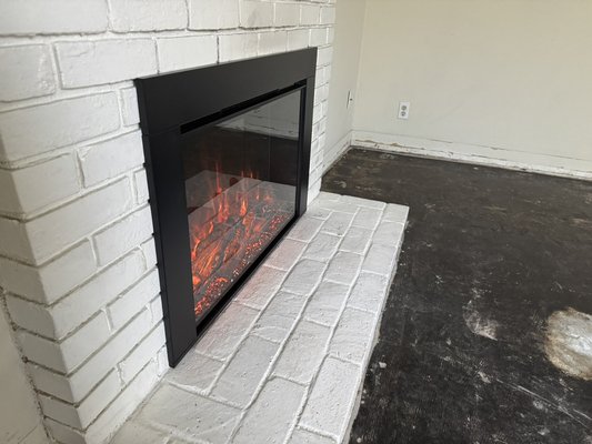 Electric fireplace insert installation - This property owner did not want their tenants using an old damaged wood-burning fireplace. Electric fireplaces eliminate these problems and add value to your home.  Electric fireplace insert installation - This property owner did not want their tenants using an old damaged wood-burning fireplace. Electric fireplaces eliminate these problems and add value to your home. 