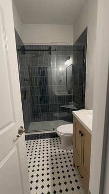 Bathroom Renovation - Beautiful bathroom remodel featuring black‑and‑white marble floors, a new vanity, relocated shower plumbing, and a custom corner bench. We installed 3x12 tiles in a vertical 50% brick pattern, along with a tile‑ready drain for a seamless shower floor. The owner absolutely loved it and we are so happy and thrilled. Remember the customer didn’t pay until we we met his satisfaction   Bathroom Renovation - Beautiful bathroom remodel featuring black‑and‑white marble floors, a new vanity, relocated shower plumbing, and a custom corner bench. We installed 3x12 tiles in a vertical 50% brick pattern, along with a tile‑ready drain for a seamless shower floor. The owner absolutely loved it and we are so happy and thrilled. Remember the customer didn’t pay until we we met his satisfaction  