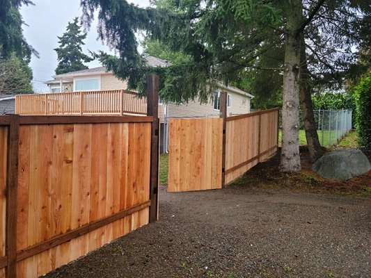 Cedar Privacy Fence - Our awesome crew just finished a 6ft cedar perimeter fence with a double drive-through gate, a man gate, and a 2ft privacy lattice addition along one side!