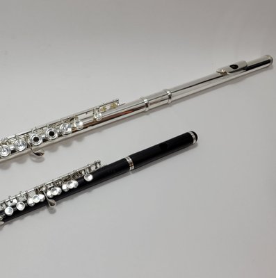 Overhauls at Fluteworks Seattle - We overhaul fine handmade flutes and beginning/intermediate flutes. Our experts enjoy and take pride in their work so that each instrument in our hands looks and plays brand new when it is done. For an Overhaul, we completely break down the instrument, removing and replacing anything that is not metal. Overhauls take 3 weeks to complete and include:
• Ultrasonic clean the entire instrument
• Machine or hand polish to a high shine
• Inspect the toneholes for flatness
• Straighten and fit the steels and align the posts
• Fit the key’s mech tubing
• Align the key cups
• Glue on all new felts, corks and foam
• Install new pads
• Regulate key closures
• Set the key opening to remove lost motion
• Fit the footjoint and headjoint if necessary (complicated fits due to dents or misalignment may incur a fee)
• Replace the headjoint cork
Please contact us today to schedule an overhaul for your flute or piccolo. Let our work speak for itself. Overhauls at Fluteworks Seattle - We overhaul fine handmade flutes and beginning/intermediate flutes. Our experts enjoy and take pride in their work so that each instrument in our hands looks and plays brand new when it is done. For an Overhaul, we completely break down the instrument, removing and replacing anything that is not metal. Overhauls take 3 weeks to complete and include:
• Ultrasonic clean the entire instrument
• Machine or hand polish to a high shine
• Inspect the toneholes for flatness
• Straighten and fit the steels and align the posts
• Fit the key’s mech tubing
• Align the key cups
• Glue on all new felts, corks and foam
• Install new pads
• Regulate key closures
• Set the key opening to remove lost motion
• Fit the footjoint and headjoint if necessary (complicated fits due to dents or misalignment may incur a fee)
• Replace the headjoint cork
Please contact us today to schedule an overhaul for your flute or piccolo. Let our work speak for itself.