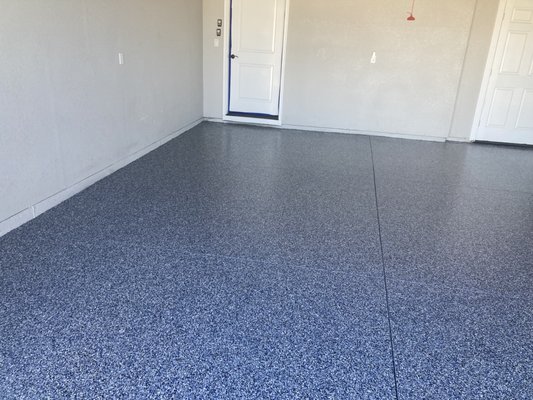 Replacing a DIY epoxy floor. - This homeowner had purchased a kit from the local big box store and installed the floor himself about 4 years ago. The DIY kits do not bond in very well and often have uneven finishes.  That was what happened here. The floor began peeling and chipping, and even had completely missing parts.