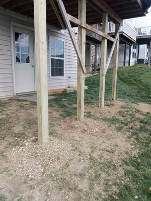 replacing 4x4 post to 4x6 to be in code compliance - The customer is selling his home. He build this deck in 2020 himself during COVID. he wanted it brought up to code compliance. We needed to change the 4x4 post to 4x6 posts. deck was 9ft 5inches in the air. anything after 8ft post are to be 4x6. we dug up and removed the concrete and the post and set new posts and poured new concrete.