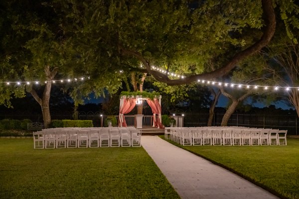 Granberry Hills - Gardenside - The Gardenside Courtyard and 4,800 sq.ft Ballroom can accommodate up to 290 guests. Our Ballroom features floor-to-ceiling windows and a vaulted ceiling with string lights. Our cozy bridal and groom suites have plenty of space for our couples to relax before ceremony. 

Additionally, you have a choice of two ceremony areas! The Arbor is perfect for a memorable outdoor ceremony, featuring beautiful drapery and tasteful greenery that create an intimate atmosphere. The Gardenside Pavilion is an additional ceremony option knowing that you can use it as a backup ceremony site for inclement weather. It is also an ideal location for a cocktail hour, or as an optional reception area for smaller receptions of 100 guests or less.