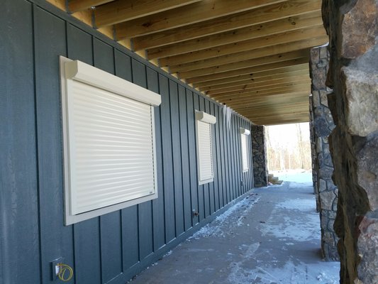 Roll Shutters - Our Magnum shutters double as both a mini-overhead door for security purposes and as a hurricane shutter.