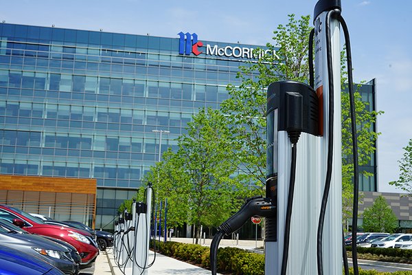 McCormick HQ EV chargers - McCormick and Company corporate headquarters in Hunt Valley, Maryland.  Clinton Electric installed ten dual-port ChargePoint charging stations for their employee lot.  This large project required underground boring to deliver power from a new 400A panel to provide power for 20 ports to offer charging to McCormick’s employees.  Standing bollard design incorporates customized McCormick logo.  Clinton Electric managed all aspects of this project including upgrading electrical capabilities, pulling war, and installing new conduit under the asphalt.