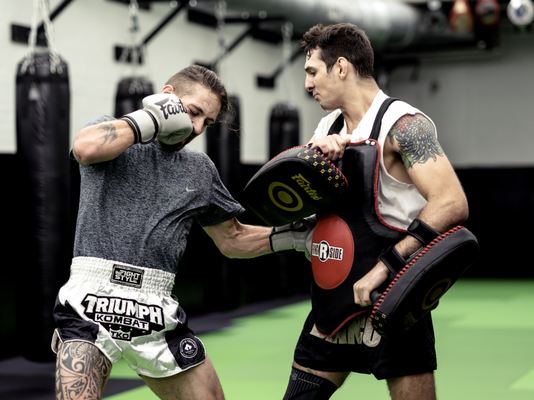 Pads & Drills - HIT & HOLD. PADS & DRILLS IS AN ALL LEVEL CLASS FOCUSED ON UNIQUE STANDUP KICKBOXING AND MUAY THAI TRAINING. THIS CLASS UTILIZES THAI PADS, BELLY PADS, AND FOCUS MITTS IN PARTNER ROTATION DRILLS TO DEVELOP PROPER TECHNIQUES AND COMBINATION TRAINING ALL WHILE GETTING AN INTENSE WORKOUT. Pads & Drills - HIT & HOLD. PADS & DRILLS IS AN ALL LEVEL CLASS FOCUSED ON UNIQUE STANDUP KICKBOXING AND MUAY THAI TRAINING. THIS CLASS UTILIZES THAI PADS, BELLY PADS, AND FOCUS MITTS IN PARTNER ROTATION DRILLS TO DEVELOP PROPER TECHNIQUES AND COMBINATION TRAINING ALL WHILE GETTING AN INTENSE WORKOUT.