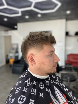 Embrace the New Year with the Trendsetting Burst Fade!" - Elevate your look with our diverse haircuts – timeless classics and contemporary trends tailored to showcase your unique style and confidence.