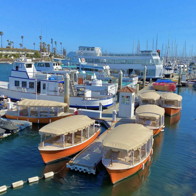 Electric Boat Rentals - Cruise up and down beautiful Channel Islands Harbor with family and friends, and even meet a few sea lions along the way. Bring drinks and dinner and enjoy a sunset cruise, and play your own music via our on board Bluetooth system. Our 21 foot Duffy electric boats feature seating room for up to 10 people, a full canopy top and full window enclosures. Reservations are recommended. Electric Boat Rentals - Cruise up and down beautiful Channel Islands Harbor with family and friends, and even meet a few sea lions along the way. Bring drinks and dinner and enjoy a sunset cruise, and play your own music via our on board Bluetooth system. Our 21 foot Duffy electric boats feature seating room for up to 10 people, a full canopy top and full window enclosures. Reservations are recommended.