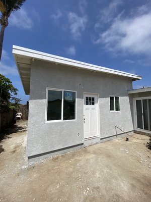 Imperial Beach Attached ADU - This project is an attached accessory dwelling unit to the rear of the main residence. It includes a common kitchen living area along with a bedroom, bathroom, and laundry area. Imperial Beach Attached ADU - This project is an attached accessory dwelling unit to the rear of the main residence. It includes a common kitchen living area along with a bedroom, bathroom, and laundry area.
