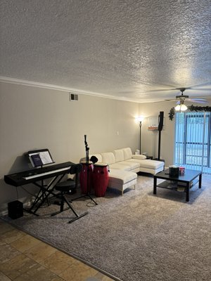 A Look Inside Melodic Studios - Our studio is equipped with top-quality instruments and sound systems to enhance your learning experience:

Yamaha Music Synthesizer S90XS Keyboard: Offering a wide range of sounds and features, perfect for both beginners and advanced students.

Electro Voice Evolve 30M PA Sound System: Ensures crystal-clear audio for lessons and performances.

Shure SM58 Microphones: Renowned for their reliability and exceptional sound quality, ideal for vocal practice and recording.


Our studio is designed to be a comfortable and inspiring space where students can thrive. With ample natural light, comfortable seating, and a welcoming atmosphere, you'll feel right at home as you explore the world of music.
