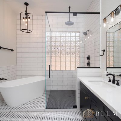 Westlake Village Bathroom Remodel - This primary bathroom in Westlake Village had great space but lacked personality. The homeowners wanted a modern, clean layout that still felt warm and luxurious. We started by removing the old tub/shower combo and closed-off vanity area. We added a large walk-in shower with black hexagon floor tile, white subway wall tile, and a bold glass block wall to bring in light while maintaining privacy. The floating tub, matte black plumbing fixtures, and custom double vanity with flat black hardware complete the look. The floor tile detail throughout ties it all together with a timeless, elevated style. Westlake Village Bathroom Remodel - This primary bathroom in Westlake Village had great space but lacked personality. The homeowners wanted a modern, clean layout that still felt warm and luxurious. We started by removing the old tub/shower combo and closed-off vanity area. We added a large walk-in shower with black hexagon floor tile, white subway wall tile, and a bold glass block wall to bring in light while maintaining privacy. The floating tub, matte black plumbing fixtures, and custom double vanity with flat black hardware complete the look. The floor tile detail throughout ties it all together with a timeless, elevated style.