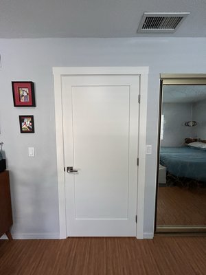 Interior Door, Jamb & Trim Replacement - This project included replacing and updating multiple interior doors, jambs, and trim throughout the home to create a cleaner, more consistent appearance while improving the fit and operation of the doors.

Four existing interior doors were removed and replaced with new solid-core shaker-style prehung doors. Each opening received new MDF casing and trim selected to closely match the existing trim profile. The new doors were carefully shimmed, leveled, secured, and adjusted for smooth operation, with existing door hardware reinstalled where feasible.

At an existing double-door opening, the original doors were kept in place while the surrounding jamb and casing were replaced. This allowed the existing doors to remain while refreshing the worn components around the opening.

The garage-entry door was also replaced with a new shaker-style garage/fire-rated style door with the appropriate wider jamb. A client-approved cat door was incorporated into the new garage-entry door to provide convenient pet access while maintaining a finished appearance.

The completed project refreshed the home's door openings with a coordinated shaker-style design, new trim and jambs, and improved door fit and functionality throughout.