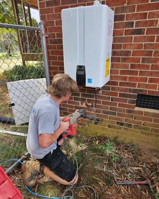 Water Heater Installation - A new conventional water heater offers improved efficiency through better insulation and modern heating elements, leading to noticeable energy savings. Smart features in newer models allow easy monitoring and adjustment through your phone. The biggest advantage is endless hot water—multiple showers, laundry, and dishes can run simultaneously without running cold. Tankless units typically last about 20 years, double the lifespan of conventional tanks, and eliminate risks of tank leaks or rust. Our water heater services include expert installation and setup of these advanced systems. Water Heater Installation - A new conventional water heater offers improved efficiency through better insulation and modern heating elements, leading to noticeable energy savings. Smart features in newer models allow easy monitoring and adjustment through your phone. The biggest advantage is endless hot water—multiple showers, laundry, and dishes can run simultaneously without running cold. Tankless units typically last about 20 years, double the lifespan of conventional tanks, and eliminate risks of tank leaks or rust. Our water heater services include expert installation and setup of these advanced systems.