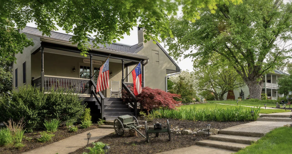 General's Quarters - The General’s Quarters provides the ultimate setting for privacy and romance. Located behind the Inn, it’s completely separate from the main building, yet only steps away. Superbly crafted and built in early 1800’s tradition with thick masonry walls, a stone foundation, and high ceilings. Features include a handcrafted pencil post bed and large bathroom with a tiled tub/shower combination.
The sitting area of the General’s Quarters highlights the 1830’s cooking fireplace, reflecting the building’s origins as a summer kitchen on the property. French doors lead to a private porch that overlook the gardens, the perfect place to unwind. The General’s Quarters commemorates the general officers serving both North and South that fought during the Battle of Antietam. General's Quarters - The General’s Quarters provides the ultimate setting for privacy and romance. Located behind the Inn, it’s completely separate from the main building, yet only steps away. Superbly crafted and built in early 1800’s tradition with thick masonry walls, a stone foundation, and high ceilings. Features include a handcrafted pencil post bed and large bathroom with a tiled tub/shower combination.
The sitting area of the General’s Quarters highlights the 1830’s cooking fireplace, reflecting the building’s origins as a summer kitchen on the property. French doors lead to a private porch that overlook the gardens, the perfect place to unwind. The General’s Quarters commemorates the general officers serving both North and South that fought during the Battle of Antietam.