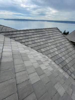 Cement Tile Roof Cleaning - During the inspection, our client notified us that the roof hadn't been cleaned for at least 5 years and upon inspection we noticed that this roof had accrued a fair amount of moss and black algae from mother nature which made it the perfect condition for a roof softwash. Our roof softwash process involves brushing any clumps of moss that we can and then applying a bleach chemical that kills any organic growth left on the roof. Cement Tile Roof Cleaning - During the inspection, our client notified us that the roof hadn't been cleaned for at least 5 years and upon inspection we noticed that this roof had accrued a fair amount of moss and black algae from mother nature which made it the perfect condition for a roof softwash. Our roof softwash process involves brushing any clumps of moss that we can and then applying a bleach chemical that kills any organic growth left on the roof.