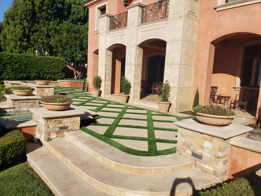 Pavers, Steppers and Decorative Rock - Utilizing Pavers, steppers, decorative rock and concrete with 4"-6" turf inlays to create beautiful contrast and accents against the artificial grass. Pavers, Steppers and Decorative Rock - Utilizing Pavers, steppers, decorative rock and concrete with 4"-6" turf inlays to create beautiful contrast and accents against the artificial grass.